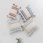 Boho cream tufted cushion cover with textured horizontal stripes and tassels for living room decor