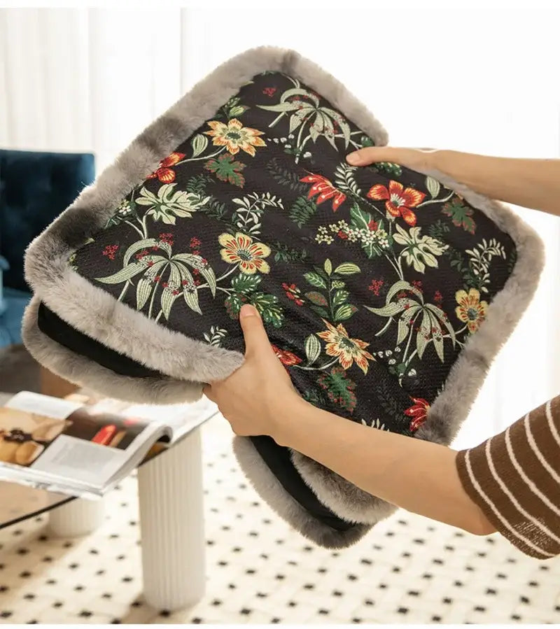 Black floral-patterned heated pad with soft gray faux fur trim.