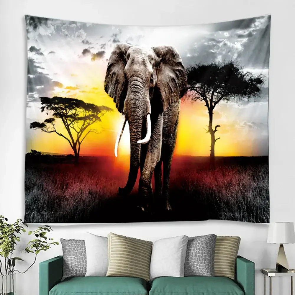 A decorbites boho elephant mandala tapestry featuring a grayscale elephant with white tusks against an orange sunset backdrop