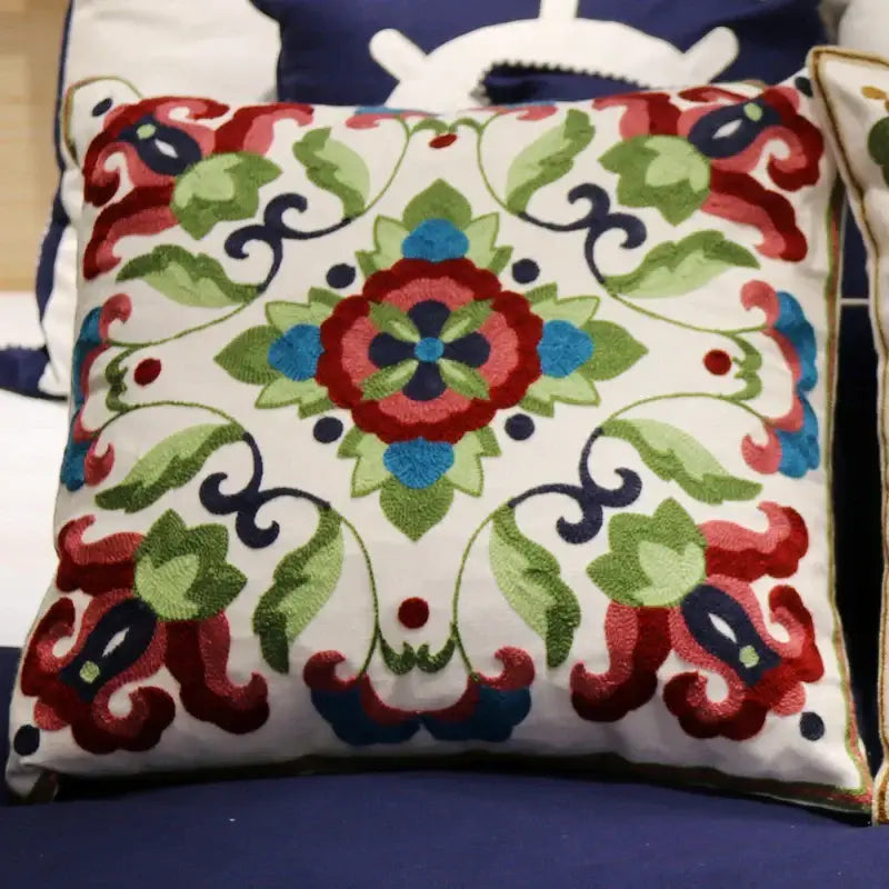 Boho ethnic flower elephant square cushion with intricate red green blue black embroidery on white fabric pillowcase