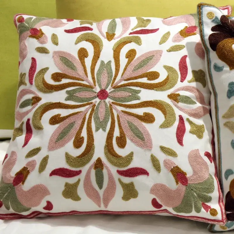 A white square flower elephant pillowcase with pink gold and olive green ethnic flower embroidery for boho decorbites decor