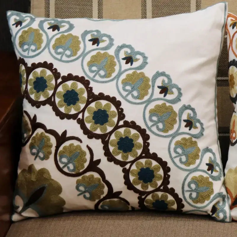 White cushion with intricate embroidered olive green teal and dark brown floral vine patterns for decorbites ethnic flower pillowcase