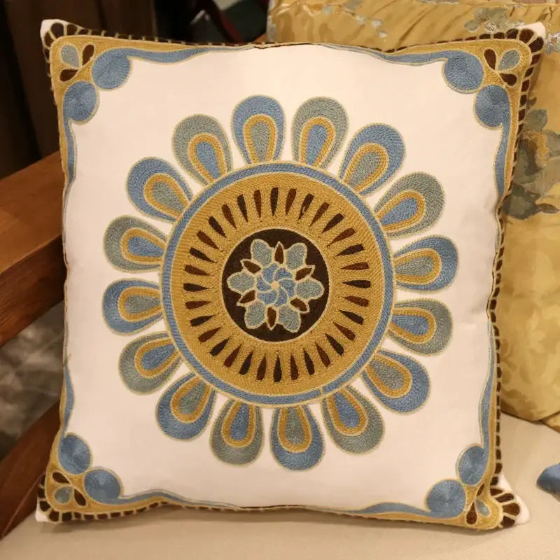 White cushion with intricate blue and gold embroidered floral design for decorbites ethnic flower elephant pillowcase decor