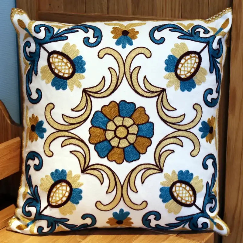 White cushion with intricate blue and gold floral embroidery for decorbites ethnic flower elephant pillowcase decor