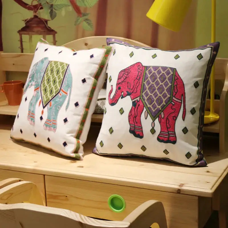 Two embroidered flower elephant pillowcases in pink and teal with ethnic flower elephant decorbites design for bedroom decor