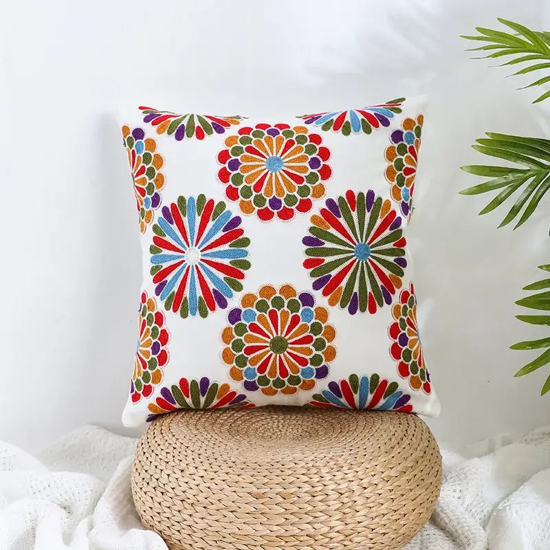 A vibrant cream pillow cover with colorful embroidered boho farmhouse floral patterns for living room decorbites decor