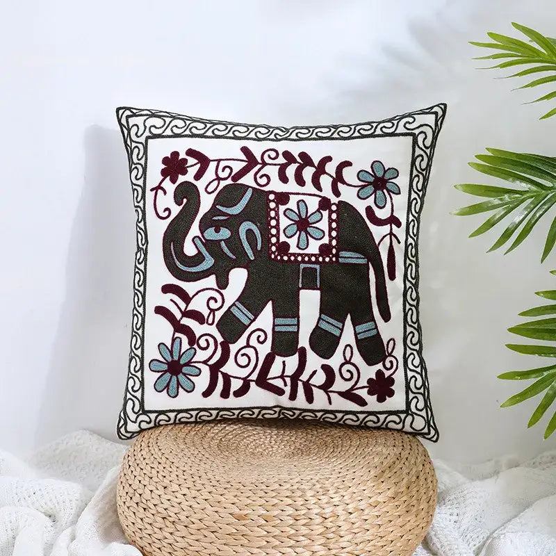 White cushion pillow cover with embroidered dark green elephant and boho farmhouse floral cream decorbites design