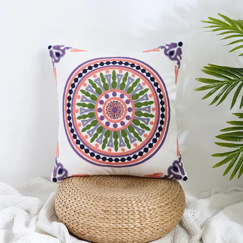 White cushion with vibrant embroidered mandala in green purple and peach on decorbites boho farmhouse floral pillow covers