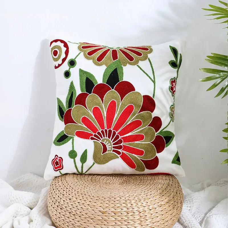 White pillow cover with vibrant red and gold embroidered floral patterns and green leaves for decorbites boho farmhouse floral decor