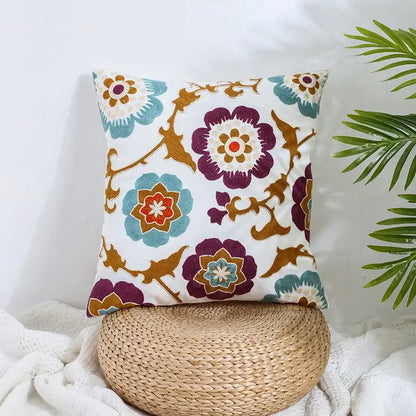Boho farmhouse floral cream embroidered pillow covers featuring purple teal and orange floral patterns for living room decor
