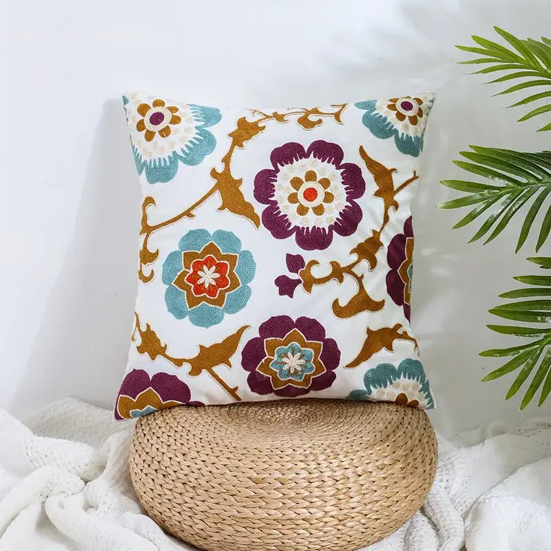 Boho farmhouse floral cream embroidered pillow covers featuring purple teal and orange floral patterns for living room decor