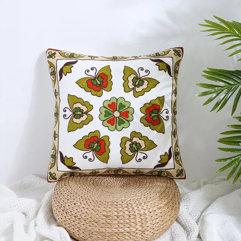 Boho farmhouse floral cream embroidered pillow covers with green red butterflies and central floral motif for living room decor