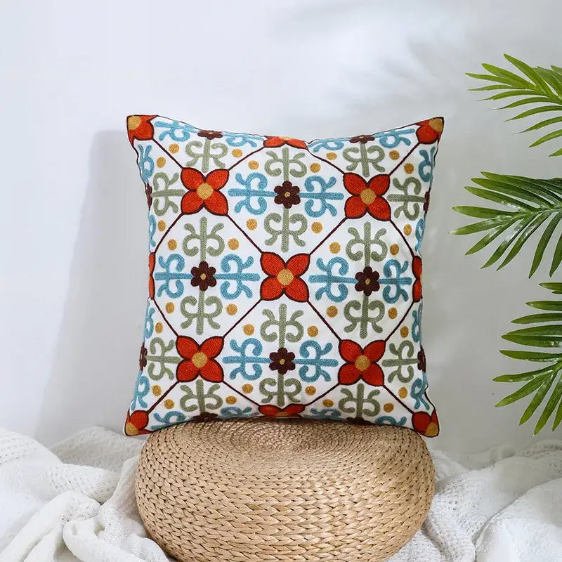 Square cream pillow covers with vibrant embroidered red and blue flowers decorbites boho farmhouse floral design