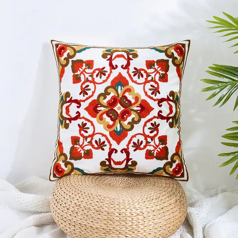 Square pillow cover with intricate red orange and gold embroidered floral patterns on cream decorbites boho farmhouse floral decor