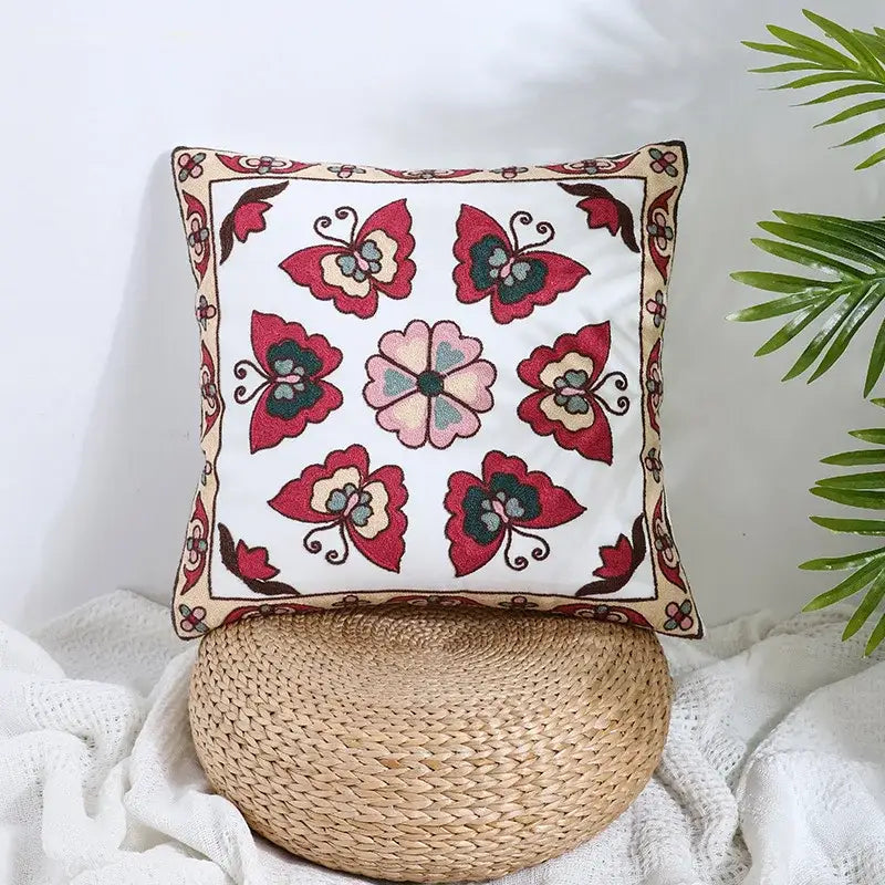 Boho farmhouse floral cream embroidered pillow covers with red and pink butterfly design and beige floral border decorbites