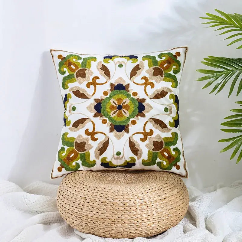 A square boho farmhouse floral cream pillow cover with intricate green brown and navy embroidery for living room decorbites decor