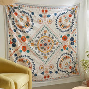 Boho floral celestial wall tapestry with vibrant embroidered diamond medallion and floral patterns in orange and blue decorbites decor