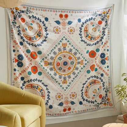 Boho floral celestial wall tapestry with vibrant embroidered diamond medallion and floral patterns in orange and blue decorbites decor