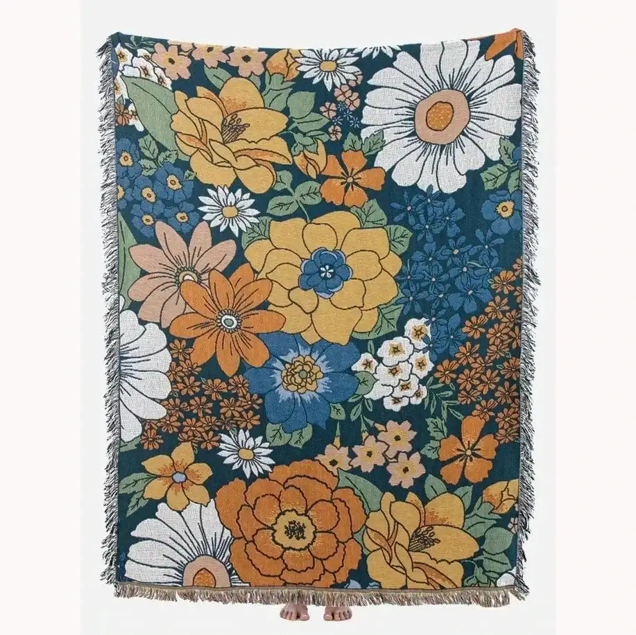 A vibrant boho floral cotton blanket with oversized yellow orange and blue flowers on navy blue background decorbites boho floral