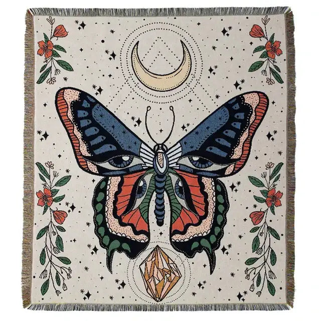 A cream-colored woven floral cotton blanket with a stylized butterfly and boho floral decorbites design navy blue and orange