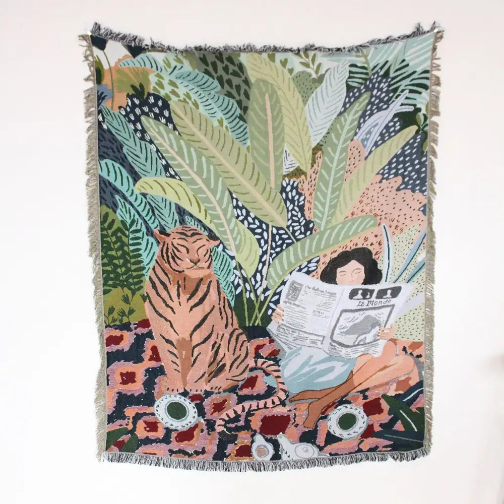 A boho floral cotton blanket with navy blue and orange featuring a woven tapestry of a woman and tiger decorbites boho floral