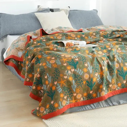 Olive green boho floral cotton gauze leisure blanket with vibrant sea-themed pattern and bold red trim decorbites cotton gauze