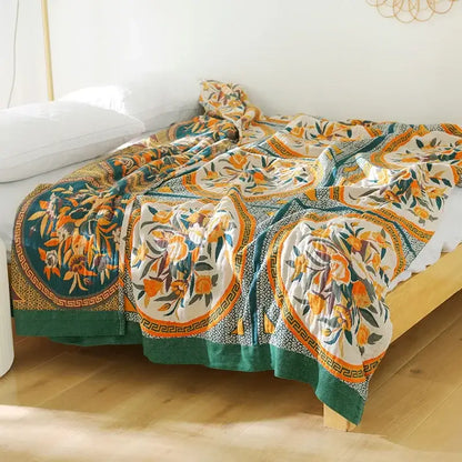 Boho floral cotton gauze leisure blanket featuring orange blossoms and teal borders on off-white decorbites cotton gauze