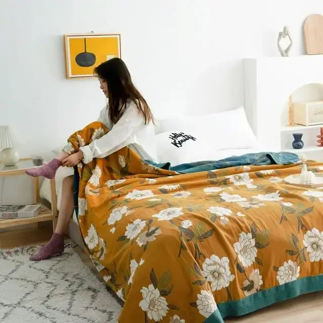 Warm mustard cotton gauze leisure blanket with white floral pattern and teal trim boho decorbites cotton gauze quilt