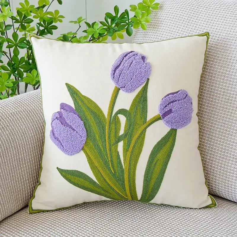 Cream-colored cushion cover with boho floral embroidered purple tulips green stems and olive-green border decorbites boho floral