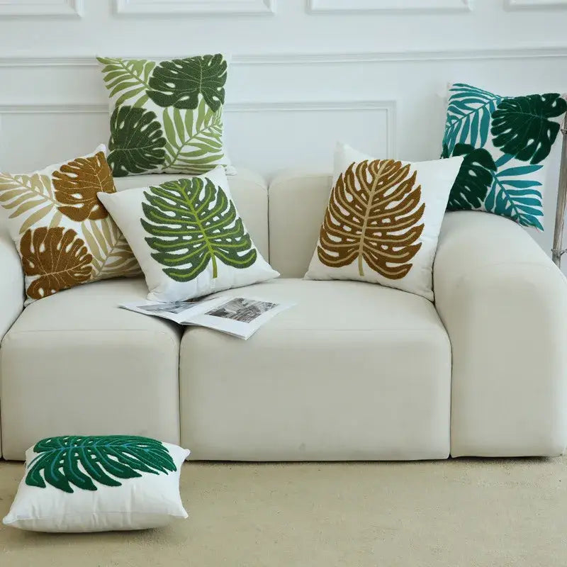 White throw pillow with boho floral embroidered green and brown monstera leaves cushion cover by decorbites