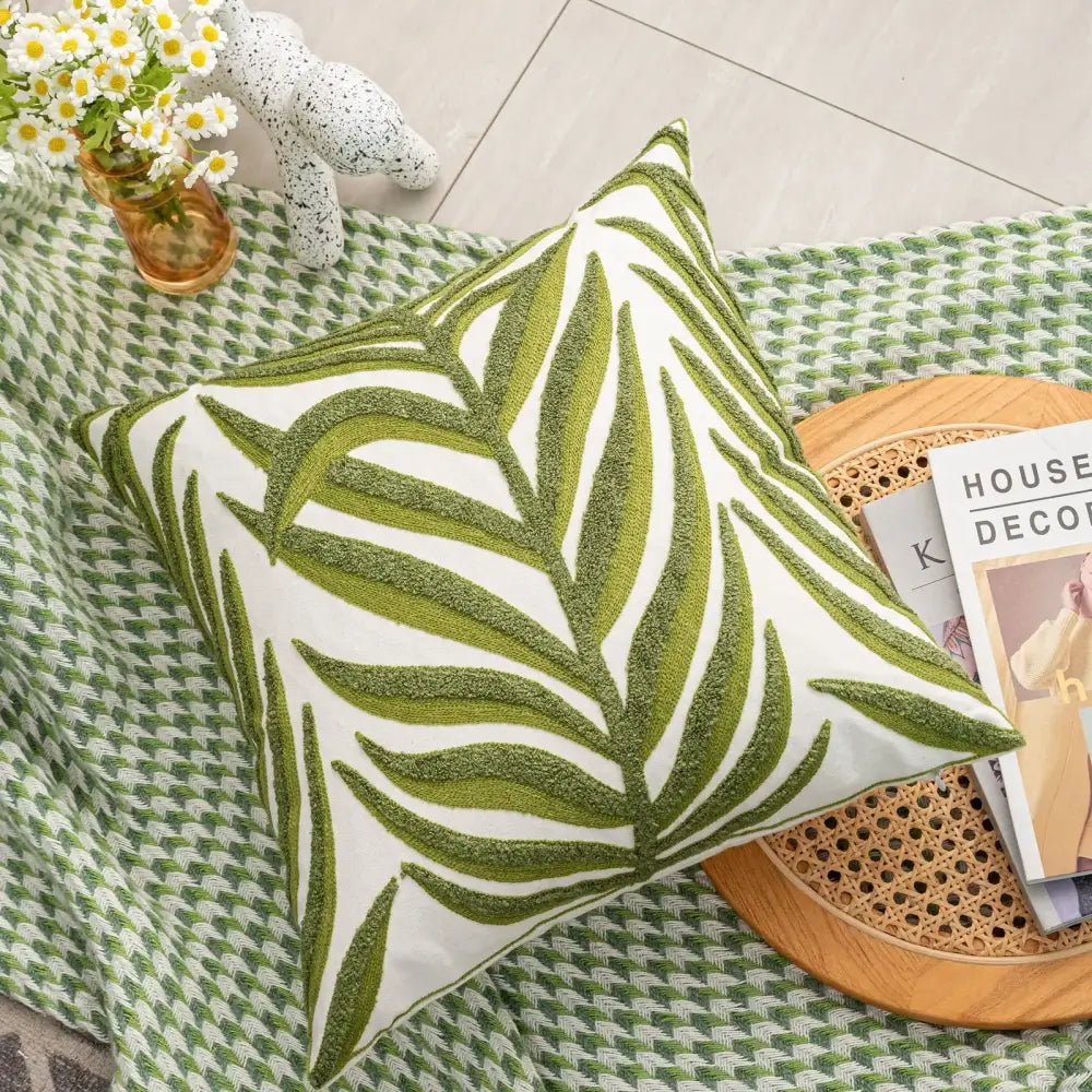 White cushion cover with boho floral embroidered green palm leaf pattern for decorbites boho floral living room decor