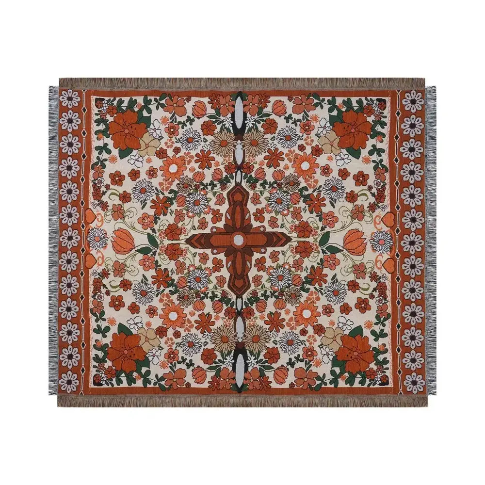 Boho floral sofa throw blanket with vibrant orange cream and green woven floral pattern and fringed edges by decorbites
