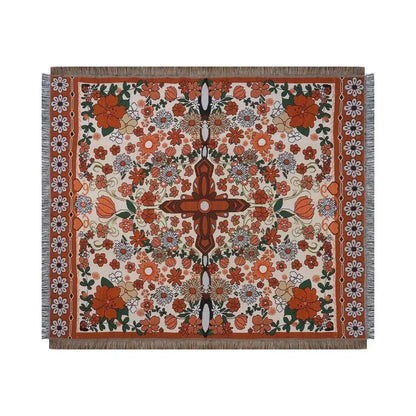 Boho floral sofa throw blanket with vibrant orange cream and green woven floral pattern and fringed edges by decorbites