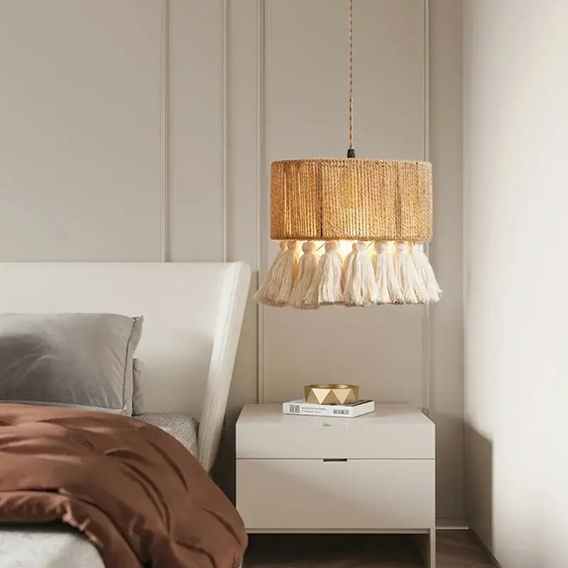 Warm-toned woven rattan pendant light with soft white tassels boho fringe hemp decorbites boho fringe design