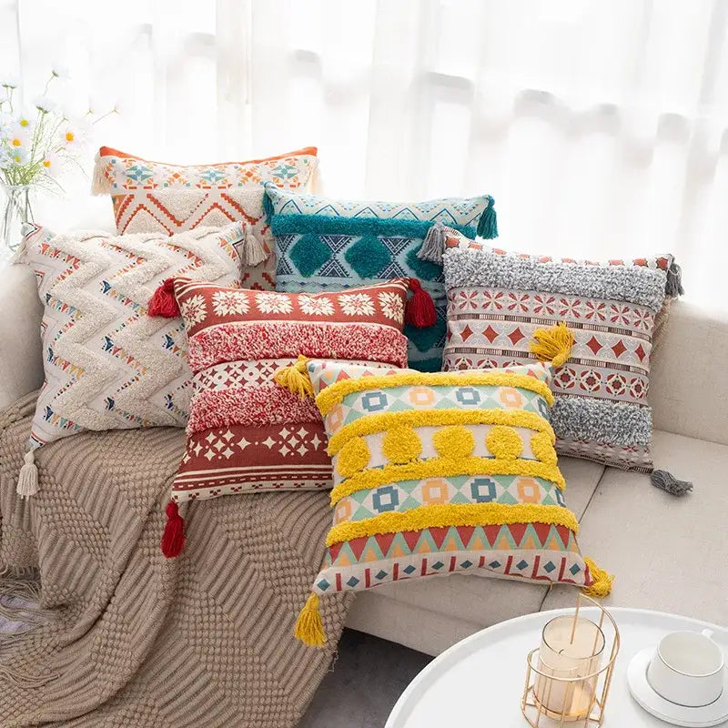 Vibrant yellow and multicolored geometric boho fringe pillow cover with fluffy tassels for living room decor by decorbites