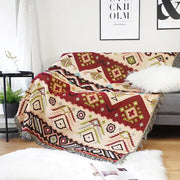 Cozy cream throw blanket with bold red green and black geometric pattern and fringed edges for decorbites geo ethnic style