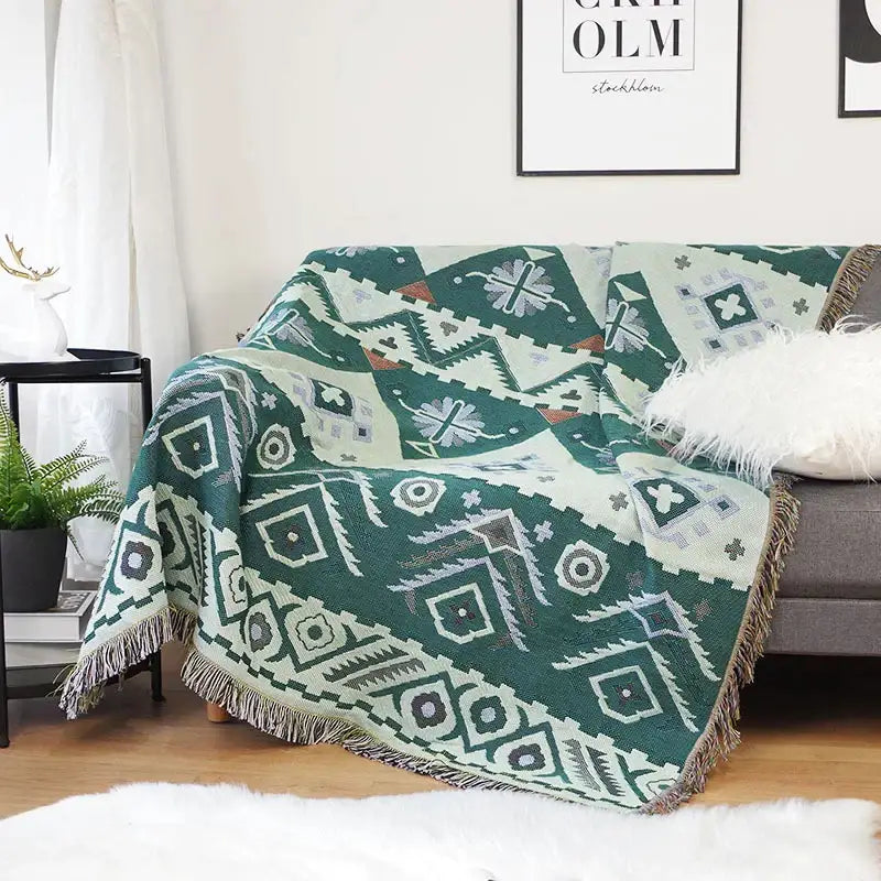 Green and cream geometric-patterned decorbites geo ethnic throw blanket with fringe edges for living room decor