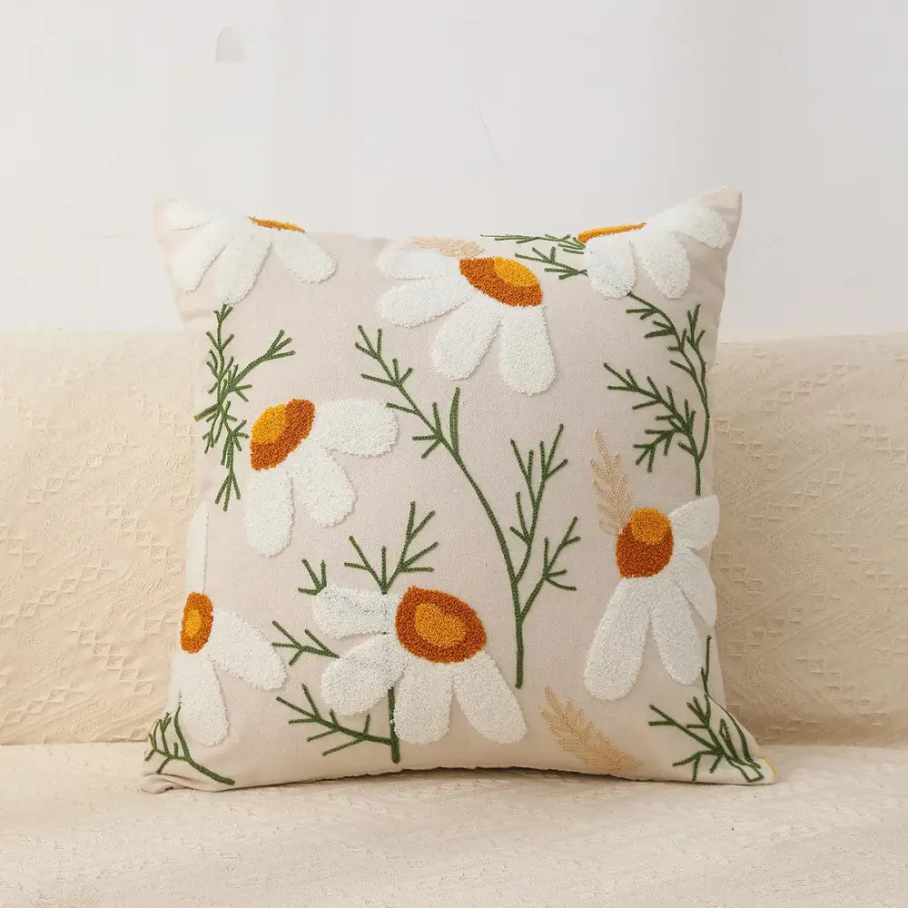 Beige boho geometric chenille embroidered pillow cover with white daisies orange centers and green stems for living room decor