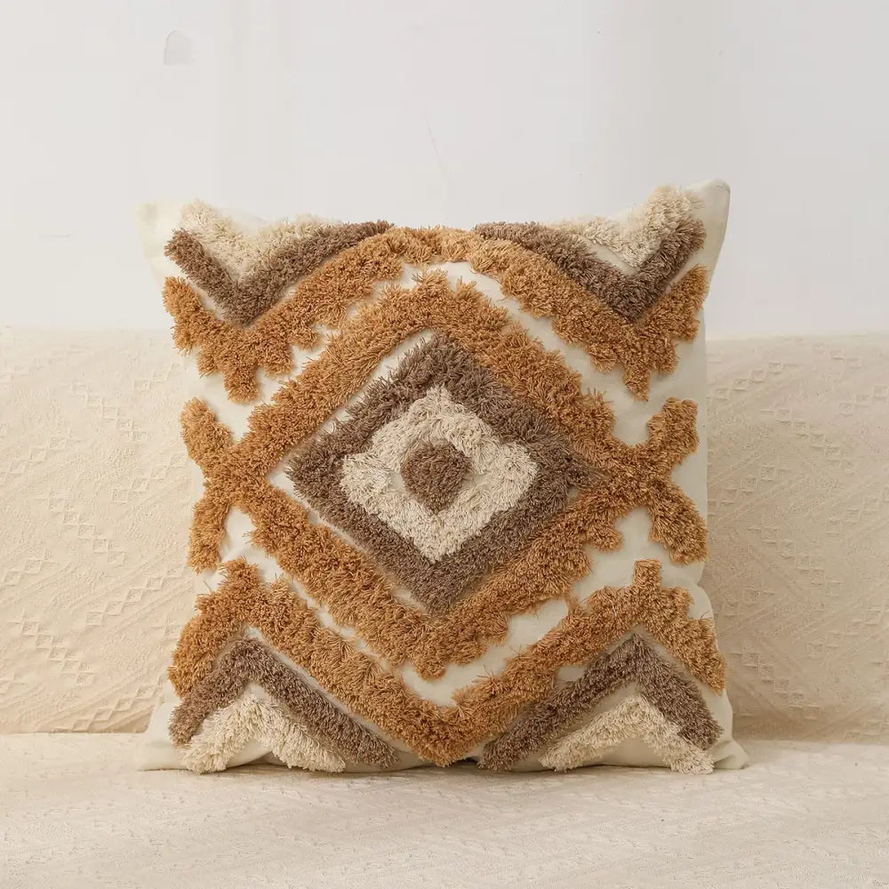 A cozy square boho geometric chenille embroidered pillow cover in beige and tan earthy tones for living room decorbites