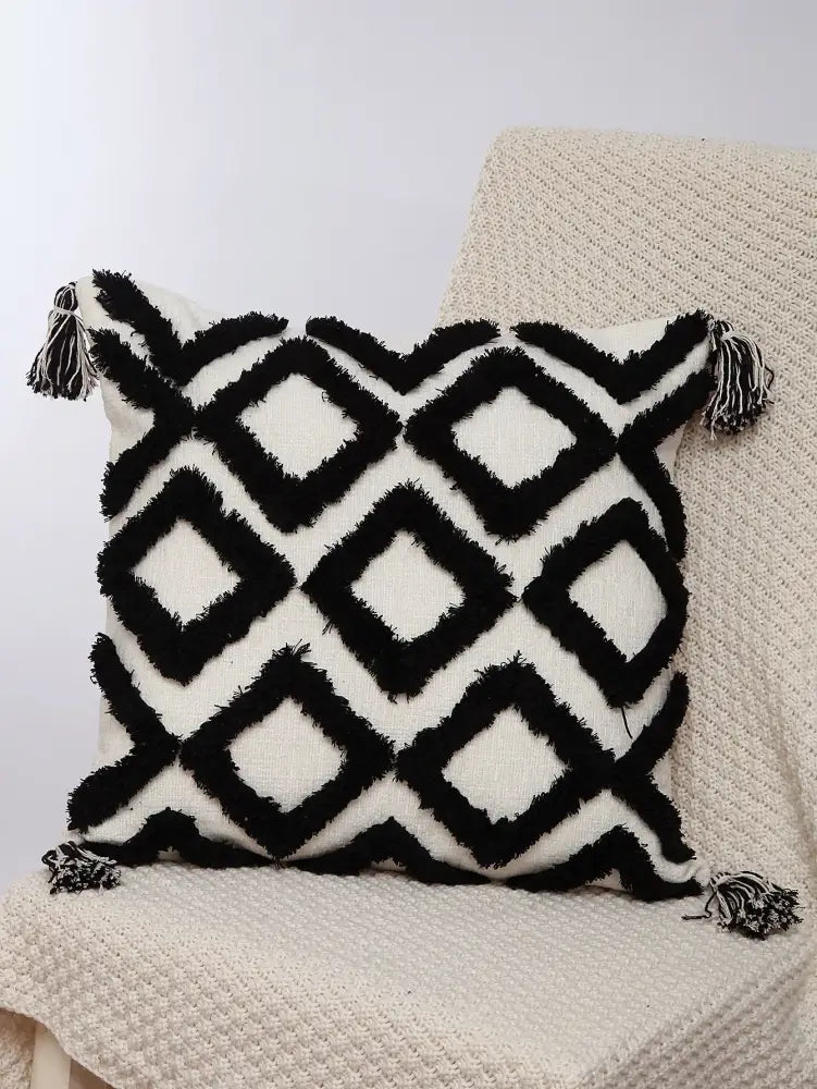 Black and white geometric chenille embroidered pillow covers with fringed edges and tassels for boho living room decorbites