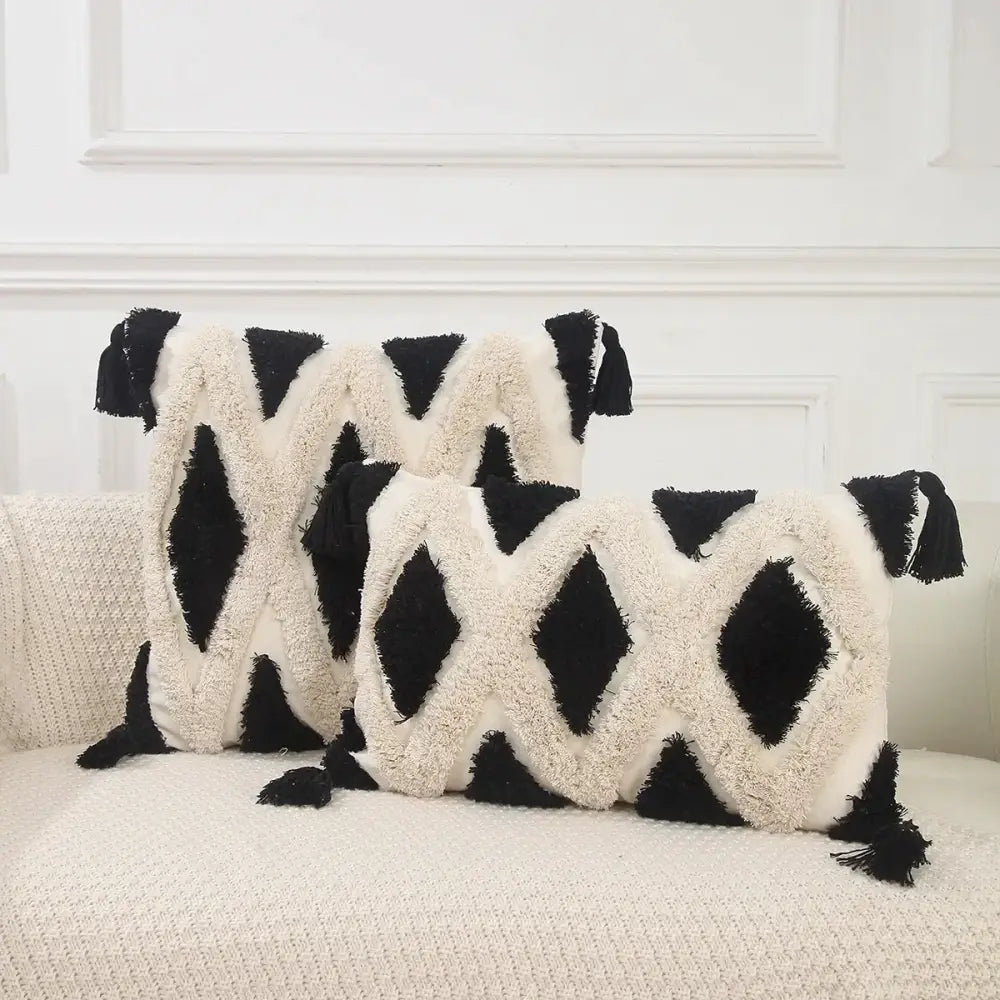 Black and cream pillow covers with boho geometric chenille embroidered diamond patterns and tassels for living room decorbites