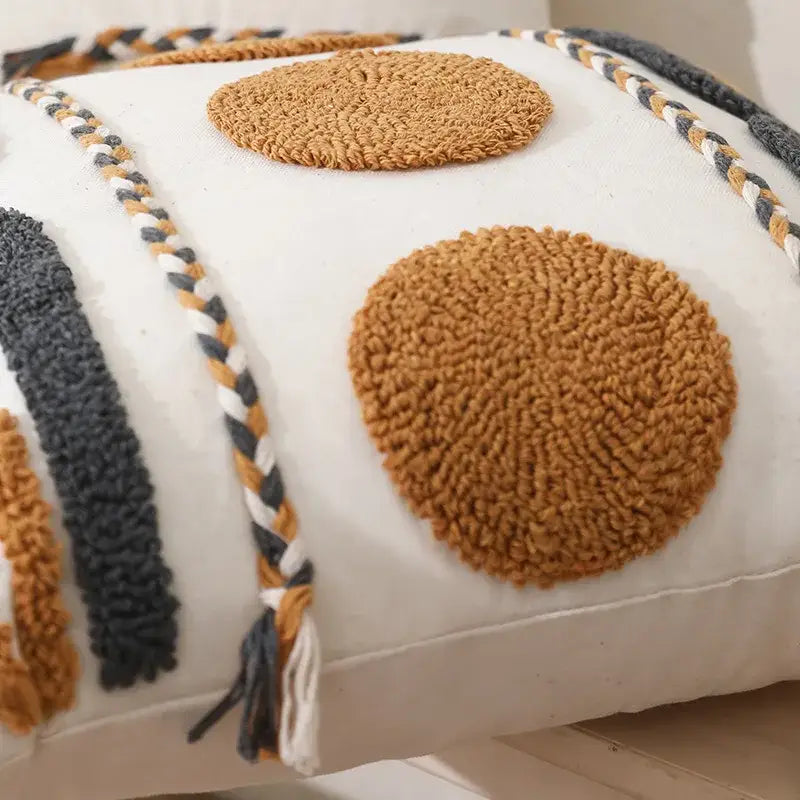 Cream-colored pouf cushion cover with textured mustard-yellow and charcoal-gray decorbites geometric embroidered cotton design