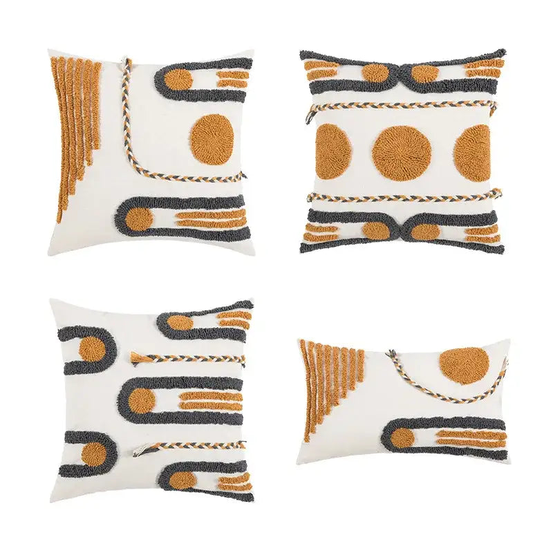 Set of four boho geometric embroidered cotton cushion covers with mustard yellow, charcoal gray, and white decorbites patterns
