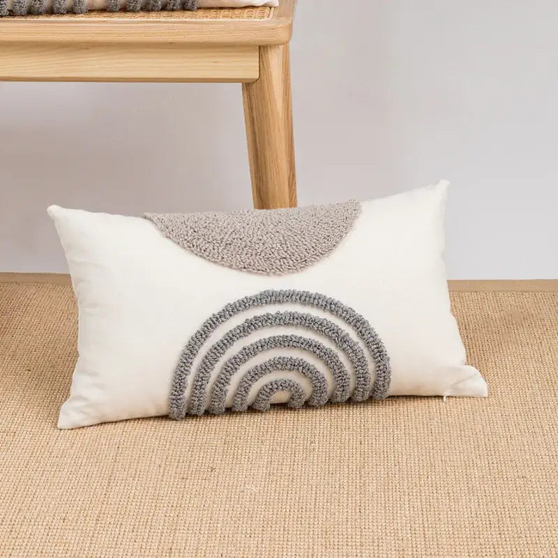 Cream-colored cushion cover with decorbites geometric embroidery boho yarn textured gray rainbow and leaf design