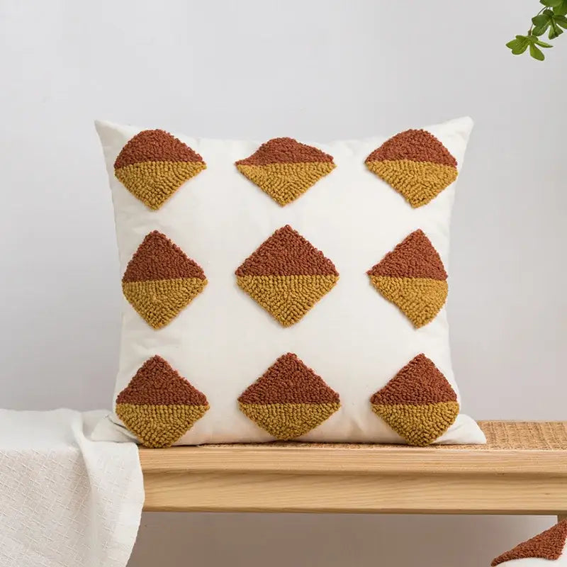 White throw pillow with nine textured two-toned diamond tufted accents in earthy brown and mustard yellow cushion cover decorbites geometric embroidery boho