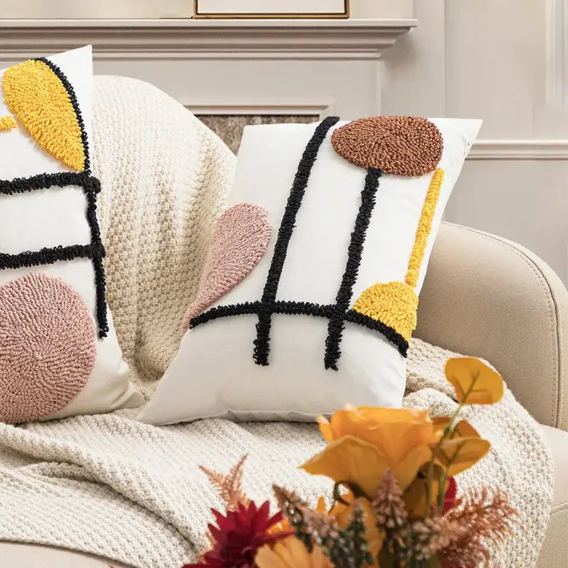 White throw pillow with colorful black yellow and pink geometric embroidery boho cushion cover decorbites style