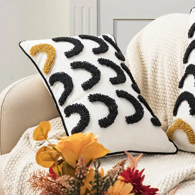 White throw pillow cushion cover with black and mustard yellow geometric embroidery boho arc patterns by decorbites