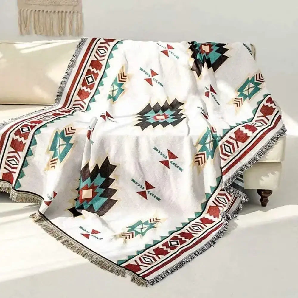 White chenille throw blanket with bold red teal and black geometric pattern and fringed edges decorbites boho chenille woven