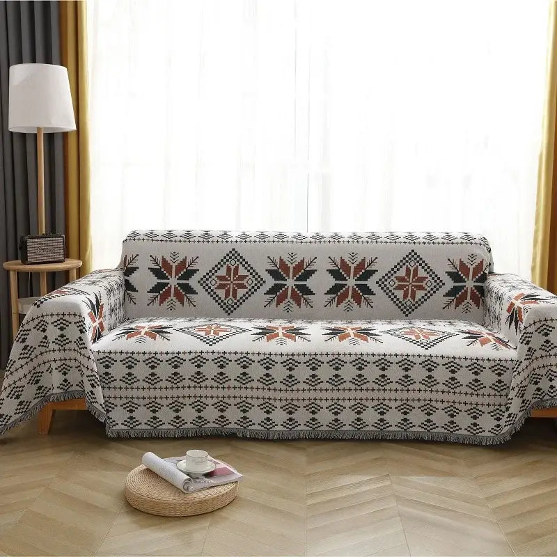 A cozy white sofa cover with a boho chenille woven geometric pattern in black red and beige for living room decorbites throw blanket