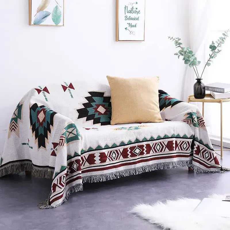 White throw blanket with teal maroon and black geometric patterns and fringed edges decorbites boho chenille woven